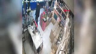 The suspended ceiling collapsed on the business owner; the moment was caught on camera.
