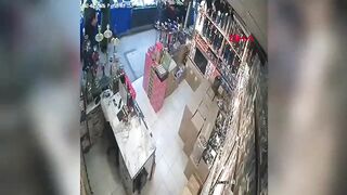 The suspended ceiling collapsed on the business owner; the moment was caught on camera.