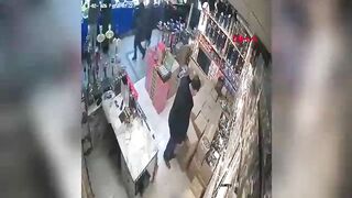 The suspended ceiling collapsed on the business owner; the moment was caught on camera.