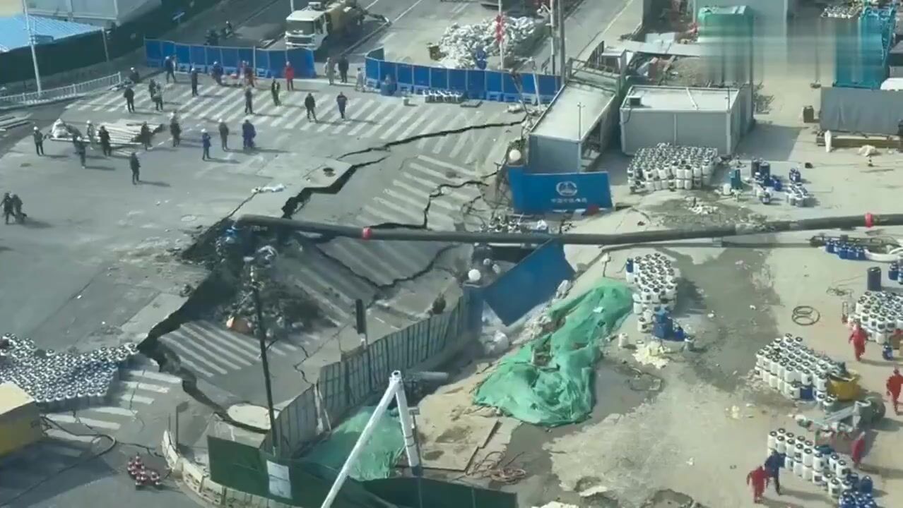 massive sinkhole suddenly opened in Shanghai swallowing a large section of roadway