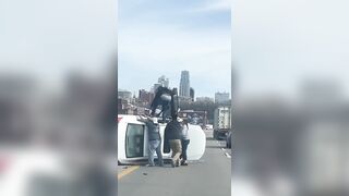 Car flipped over on the highway, leaving a mother and child trapped inside