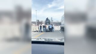 Car flipped over on the highway, leaving a mother and child trapped inside