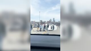 Car flipped over on the highway, leaving a mother and child trapped inside