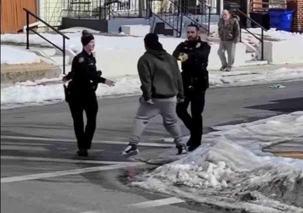 A male officer holstered his taser during an arrest in Minneapolis and was punched in the face by a resisting suspect.