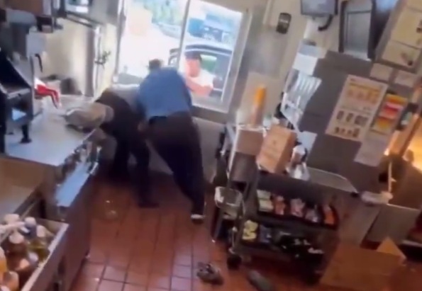 McDonalds Kitchen Brawl hile Man waits at the Drive-Thru Window