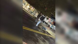 Black Man brings a Stick and Flattens White Man in the Street