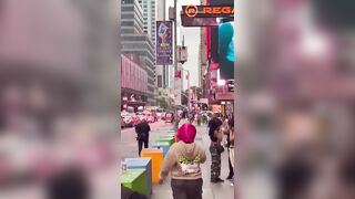 Currently in Times Square: Naked Woman being Chased by the Cops
