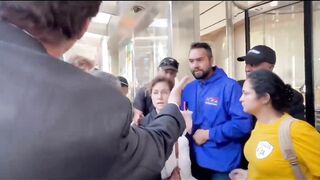 Deranged Climate Cultists Block a Woman From Entering a Bank!