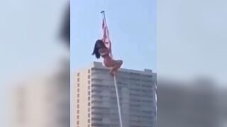Girl in Bikini Climbs Flag Pole..it does NOT End Well