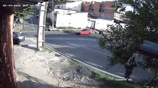 Stolen car collides with motorcycle during chase; driver was a hostage.