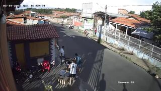 Stolen car collides with motorcycle during chase; driver was a hostage.