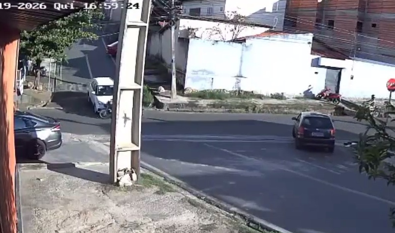 Stolen car collides with motorcycle during chase; driver was a hostage.