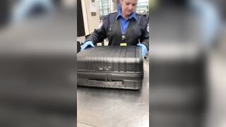 What's in this Girl's Luggage that makes this TSA Woman so happy?