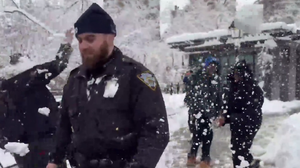 NYPD officers getting hit with snowballs in Washington Square Park this afternoon. This is shameful