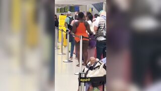 Girl Shocks Airport Naked from the Waist Down Waiting in Line (See Description)
