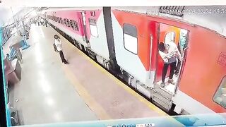 Female Train worker in Green saves the Life of Man trying to get on