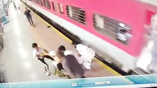 Female Train worker in Green saves the Life of Man trying to get on