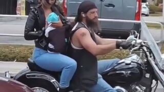 Woman Breast Feeding Baby While Smoking on the Back of a Harley just Broke the Internet. Lol