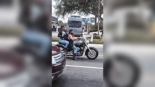 Woman Breast Feeding Baby While Smoking on the Back of a Harley just Broke the Internet. Lol