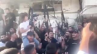 10 Year Old Girl Ak-47 in one hand, Pistol in the other. Hamas Celebrates Occupation of Israel