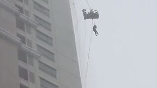 Sad Video shows Glass Cleaner stuck outside in a Storm
