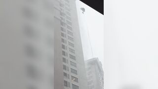 Sad Video shows Glass Cleaner stuck outside in a Storm