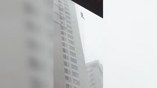Sad Video shows Glass Cleaner stuck outside in a Storm
