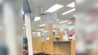 Bro Casually Steals Meds from Behind the Counter in Pharmacy