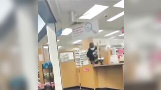 Bro Casually Steals Meds from Behind the Counter in Pharmacy