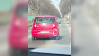 Woman nails Man on the side of the Road sending him flying. How did this happen