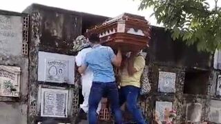 Things Go Badly for these Dudes Handling a Casket.