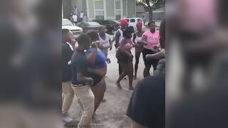 Fight breaking out at a Houston apartment complex when a woman, swinging a baseball bat, starts hitting a man