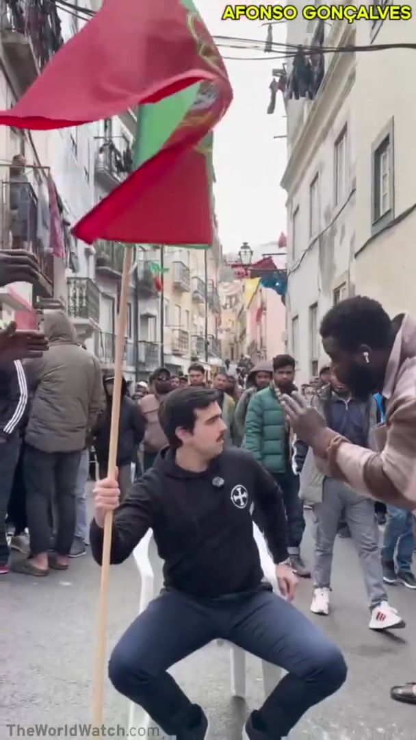 The fall of Western Europe - Afonso, a Portuguese man, sits on a Portuguese street, a