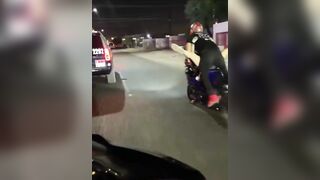 Female on her BACK on a Motorcycle Taunting the Cops...this is Wild