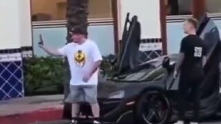 Dude sits on a Man’s Supercar and Finds Out