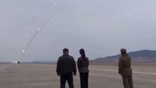 Kim Jong Un and his daughter watch rockets obliterate an island