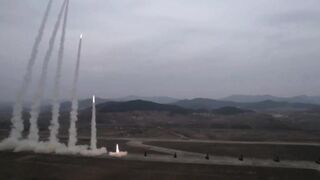 Kim Jong Un and his daughter watch rockets obliterate an island