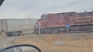 Train rips through semi-trailer stopped on tracks in Canada