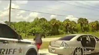 This is Wild...Man in Back Seat pulls Out Semi-Auto Machine Gun on Cops...(Watch until End) Violent Warning