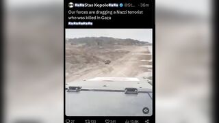 Israeli soldiers Drag a Palestinian Terrorist with a Military Vehicle