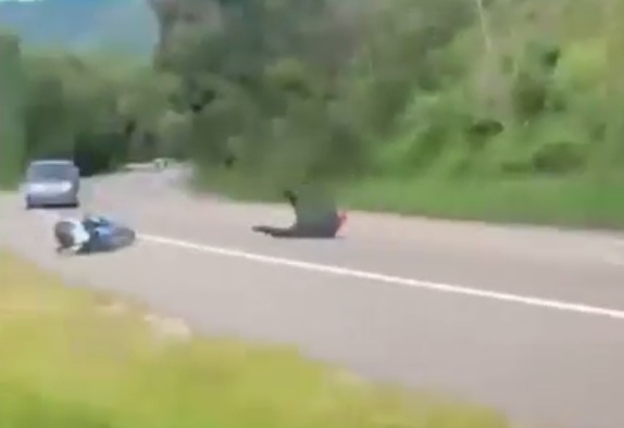Motorcyclist skids out at the WRONG Time