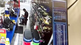 Store Clerk Checking out his New Gun Finds Out