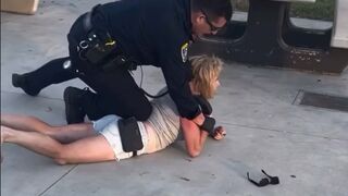 Woman gets dropped by Police Officer