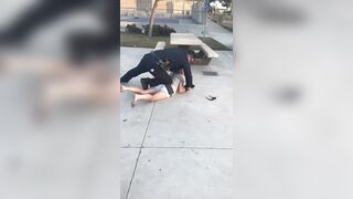 Woman gets dropped by Police Officer