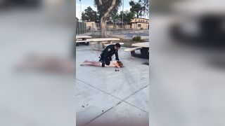 Woman gets dropped by Police Officer