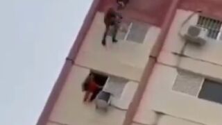 Girl in Red Stuck on High Rise Rescue goes Bad