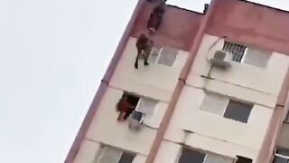 Girl in Red Stuck on High Rise Rescue goes Bad