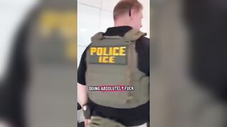 A woman confronts ICE agents with insults, calling them “race traitors” and “Nazis,”
