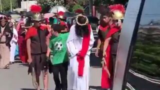 A boy with Downsyndrome comforts Jesus during a Good Friday procession in Mexico