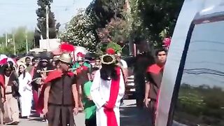A boy with Downsyndrome comforts Jesus during a Good Friday procession in Mexico